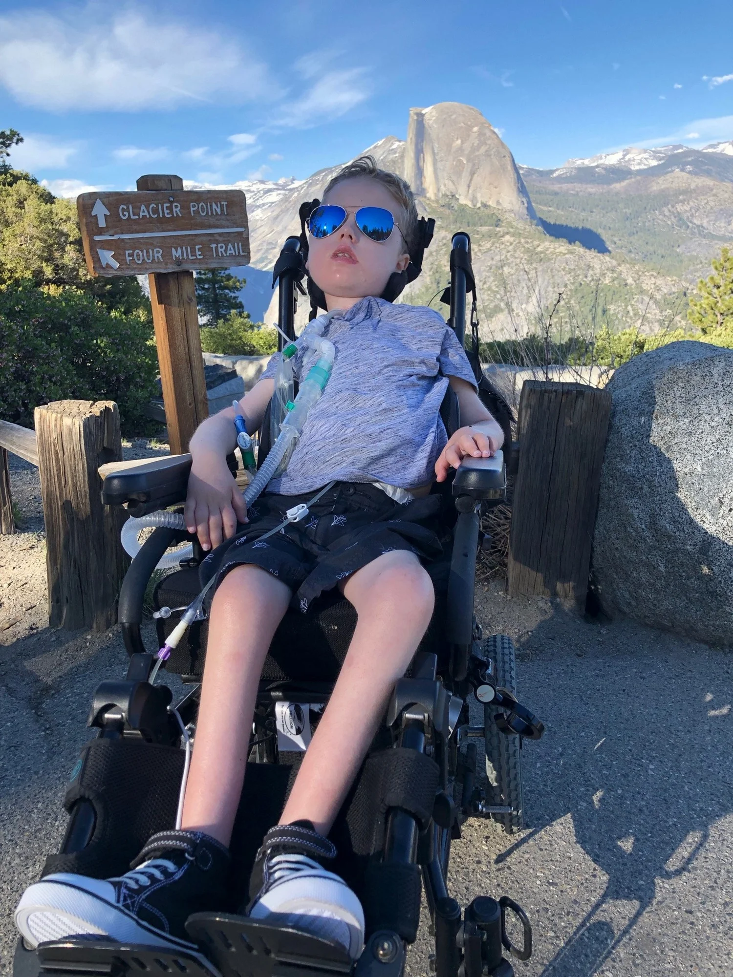 William Moore at Glacier Point in Yosemite, with Half Dome behind him