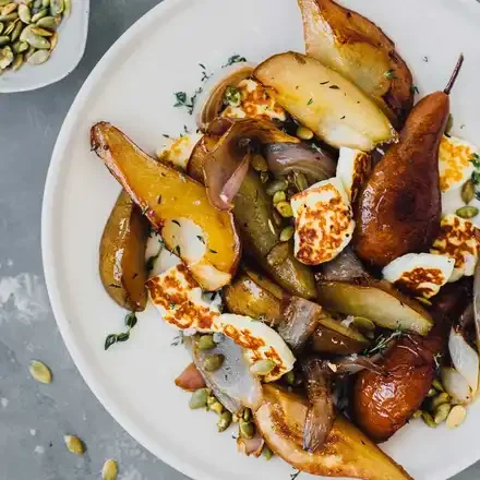 Roasted pears with haloumi, shallots and pepitas