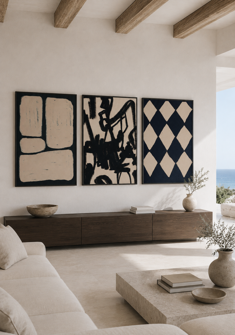 Three black and ivory works arranged in a calm living room