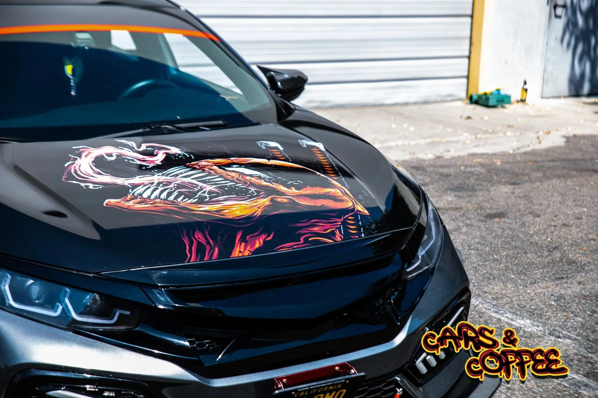 Custom graphic-wrapped car at MaxShine Cars and Coffee
