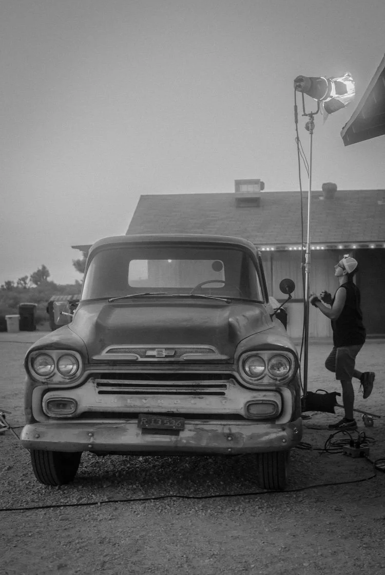 Exterior light rigged beside a vintage Chevrolet truck