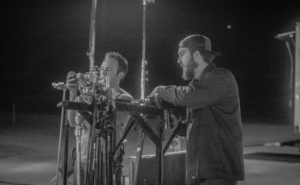 Director and camera department review the exterior camera rig