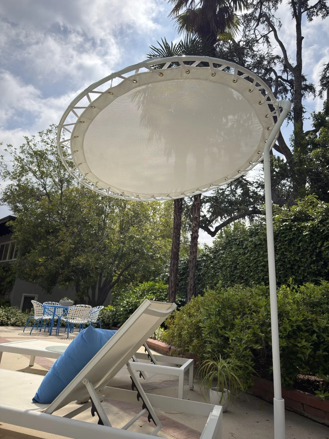 Restored white shade canopy with fitted fabric above patio loungers in Pasadena