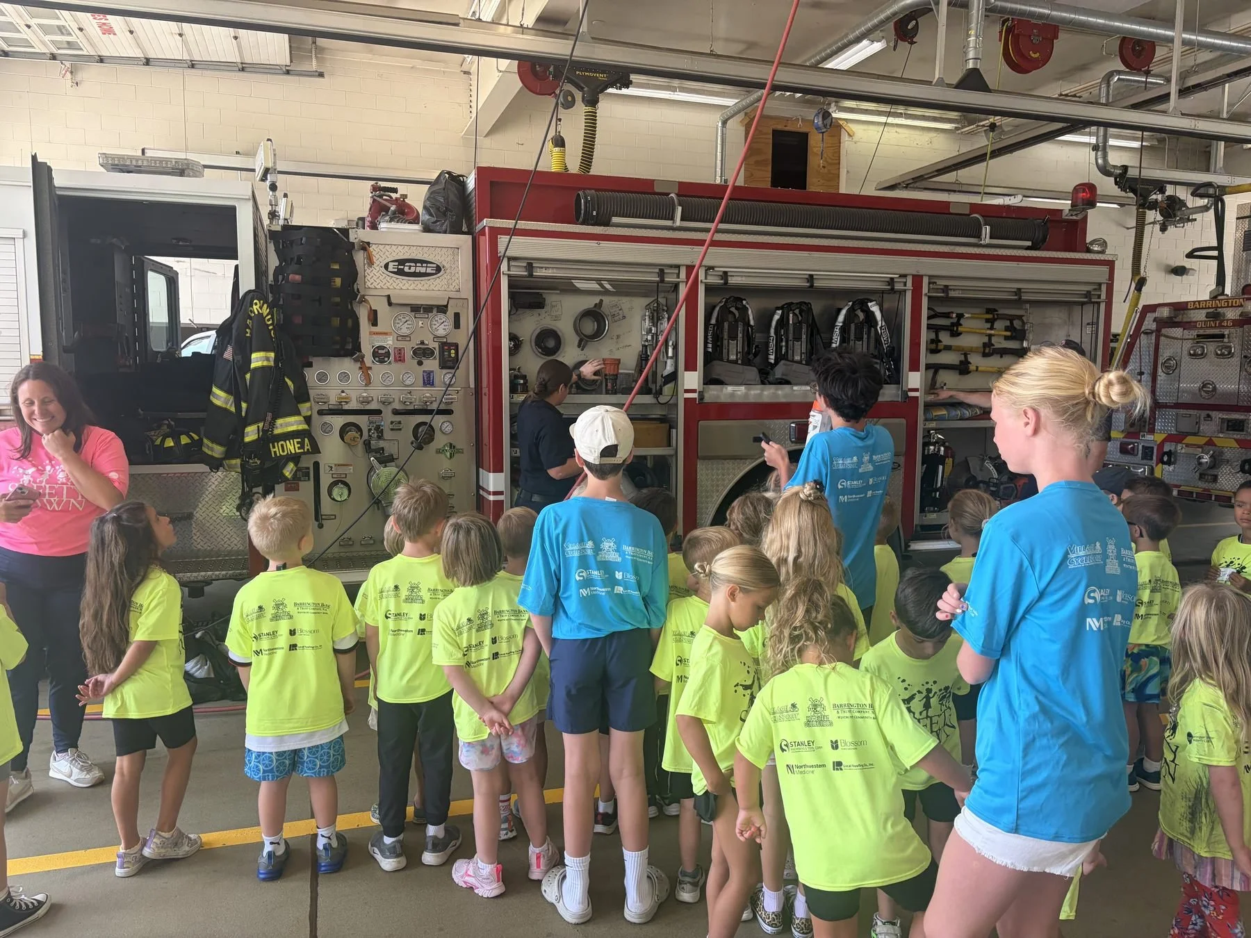 Kids visiting a fire truck at Safety Town