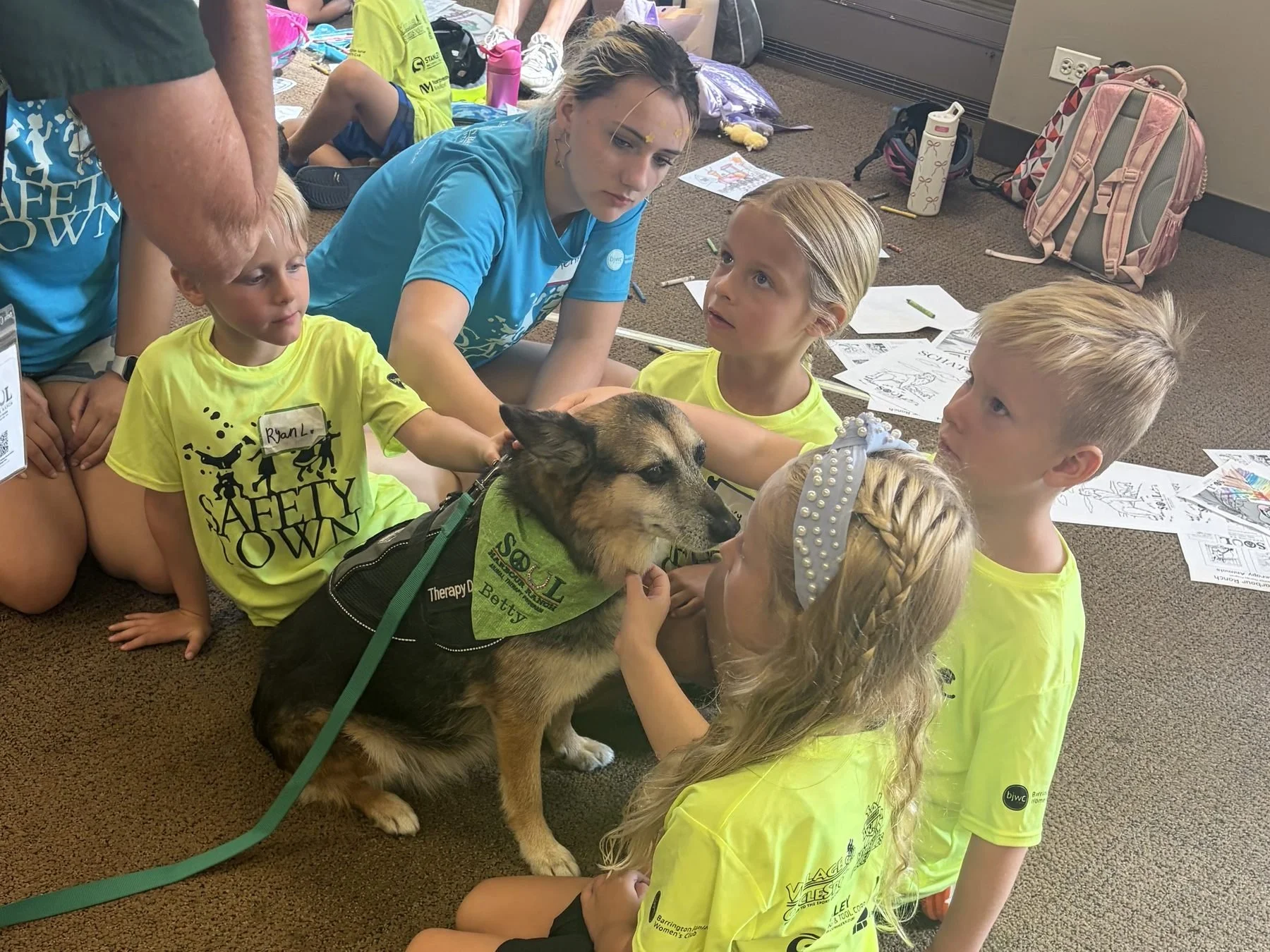 Kids petting a therapy dog at Safety Town