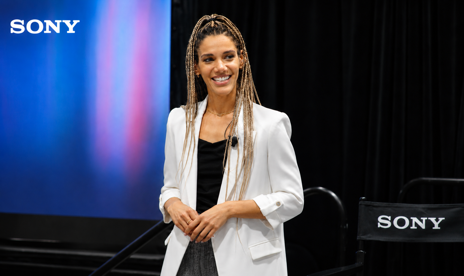 Dionna Chambers speaking on stage for Sony