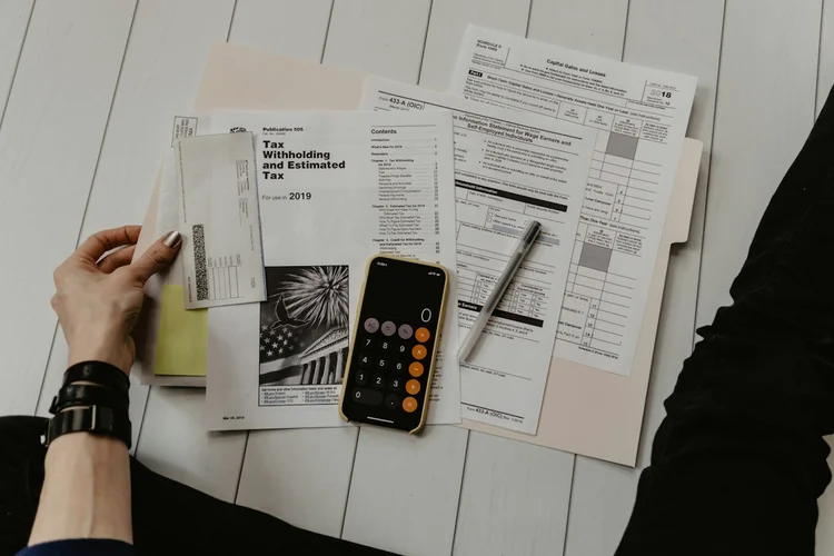 Budget papers, pen, and calculator