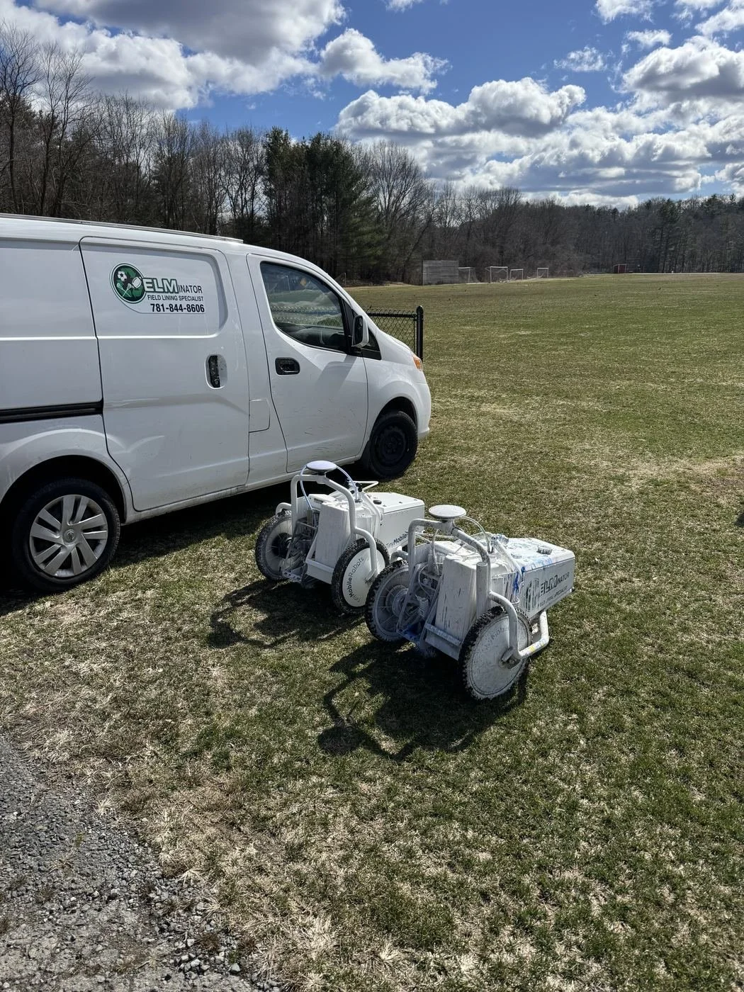 Elmscape work van and two field lining machines on a soccer field