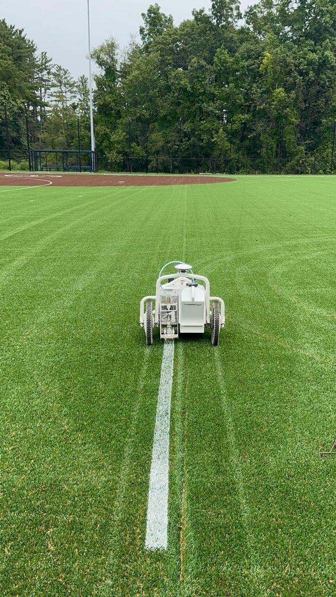 Elminator machine laying a fresh straight line on a newly set up field