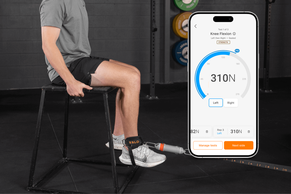 Dr. Robby conducting a movement screen and strength testing at Fort Point PT