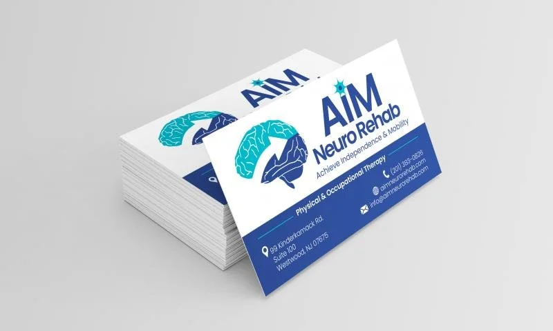 Four AIM Neuro Rehab business cards, flat