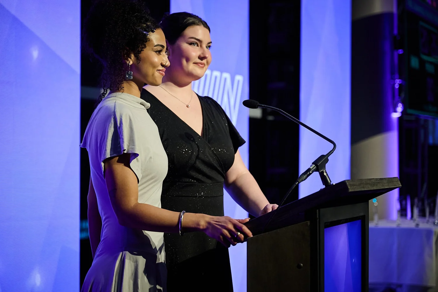 Katie Sipes and Ivy Rose Lee reciting the iWIN Pledge to open the 2026 Change Make*Hers Gala