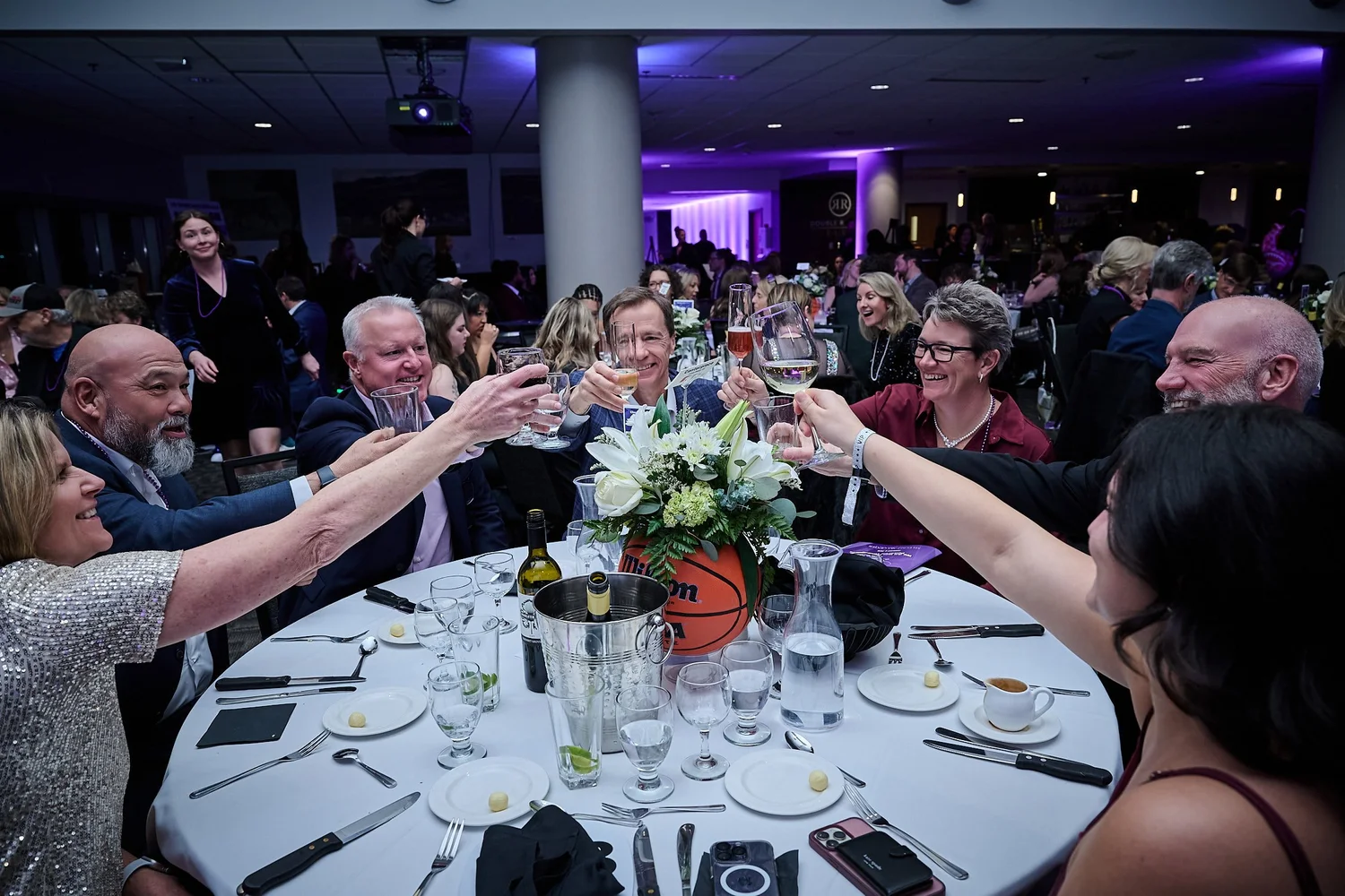 Guests toast at the Change Make*Hers Gala