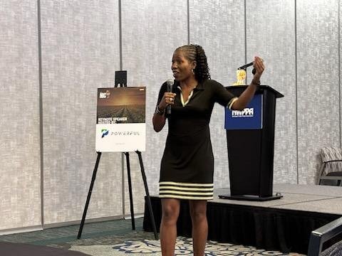 Angela Taylor speaking at a conference
