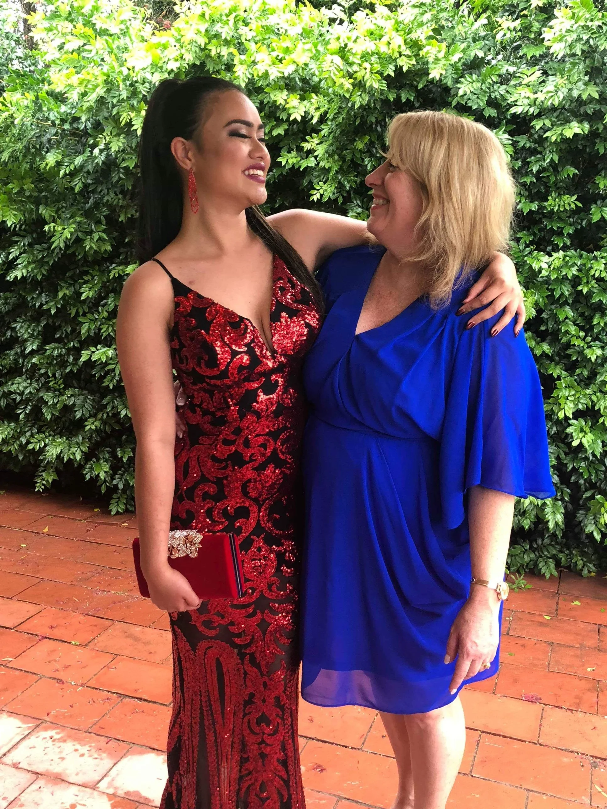 Mariana and Renae laughing together at Mariana's Year 12 formal