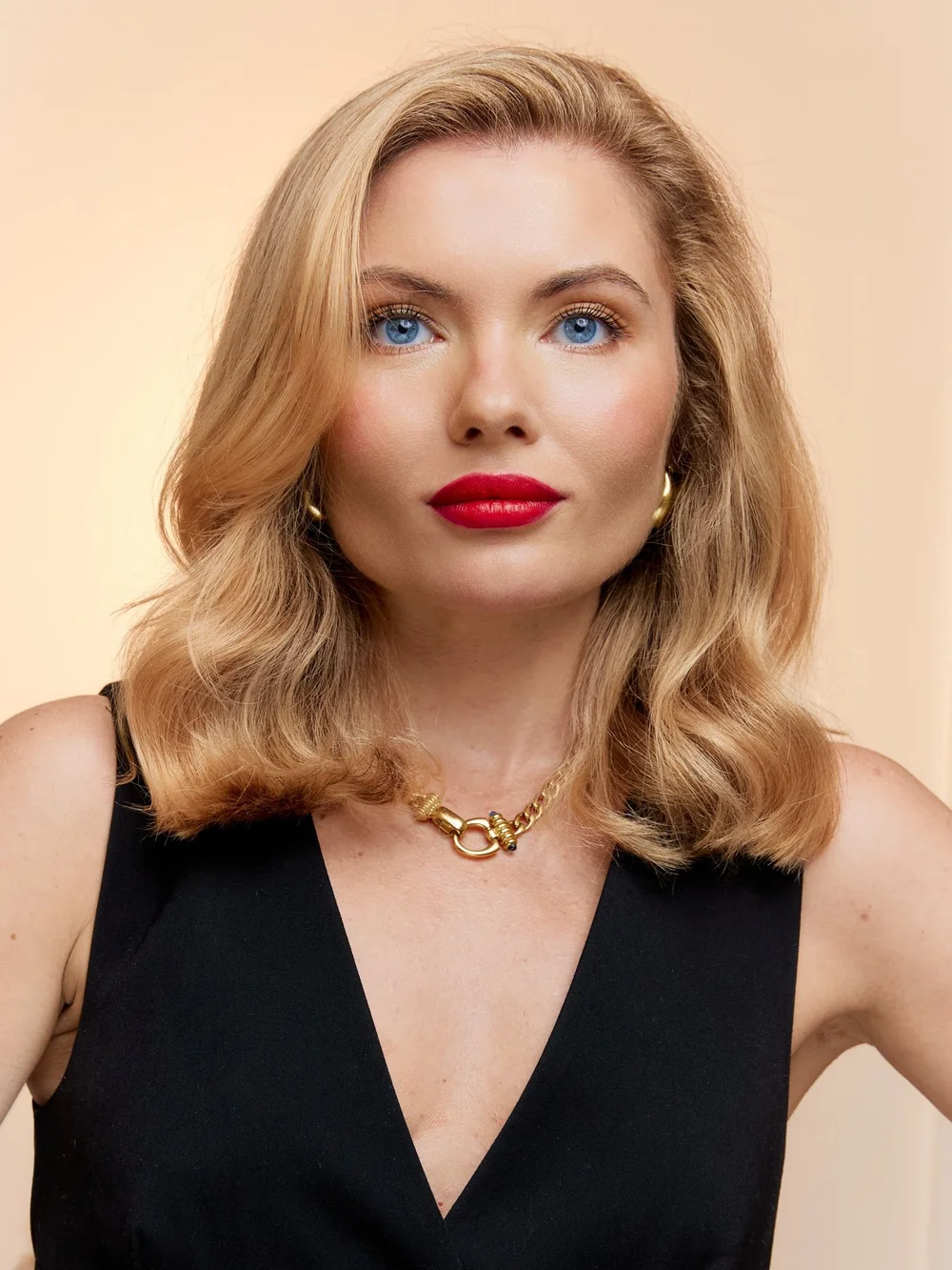 Kateryna, founder of KATYA Hair & Beauty, with soft blonde waves