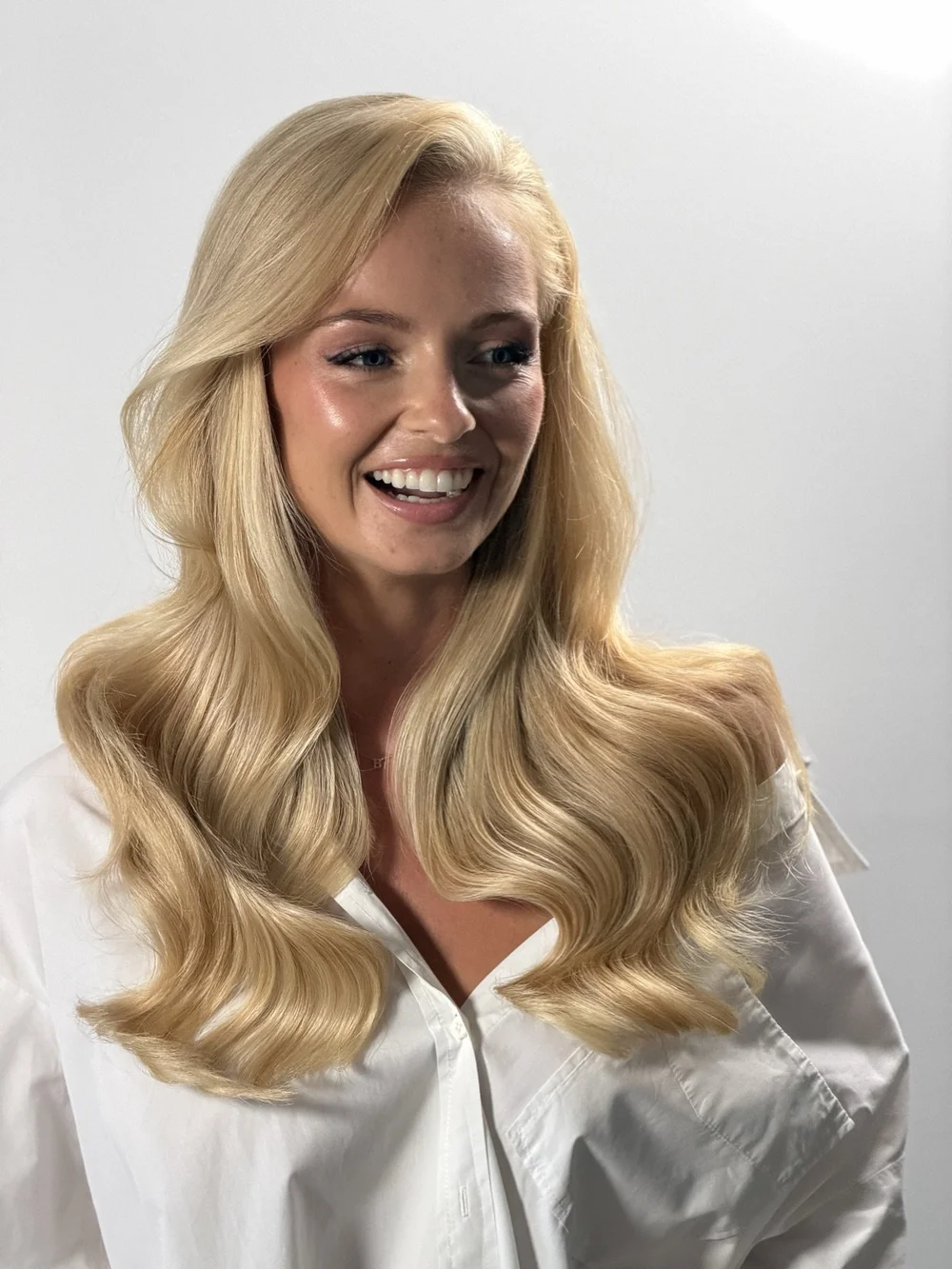 After: bright, creamy Air Touch blonde in soft glossy waves