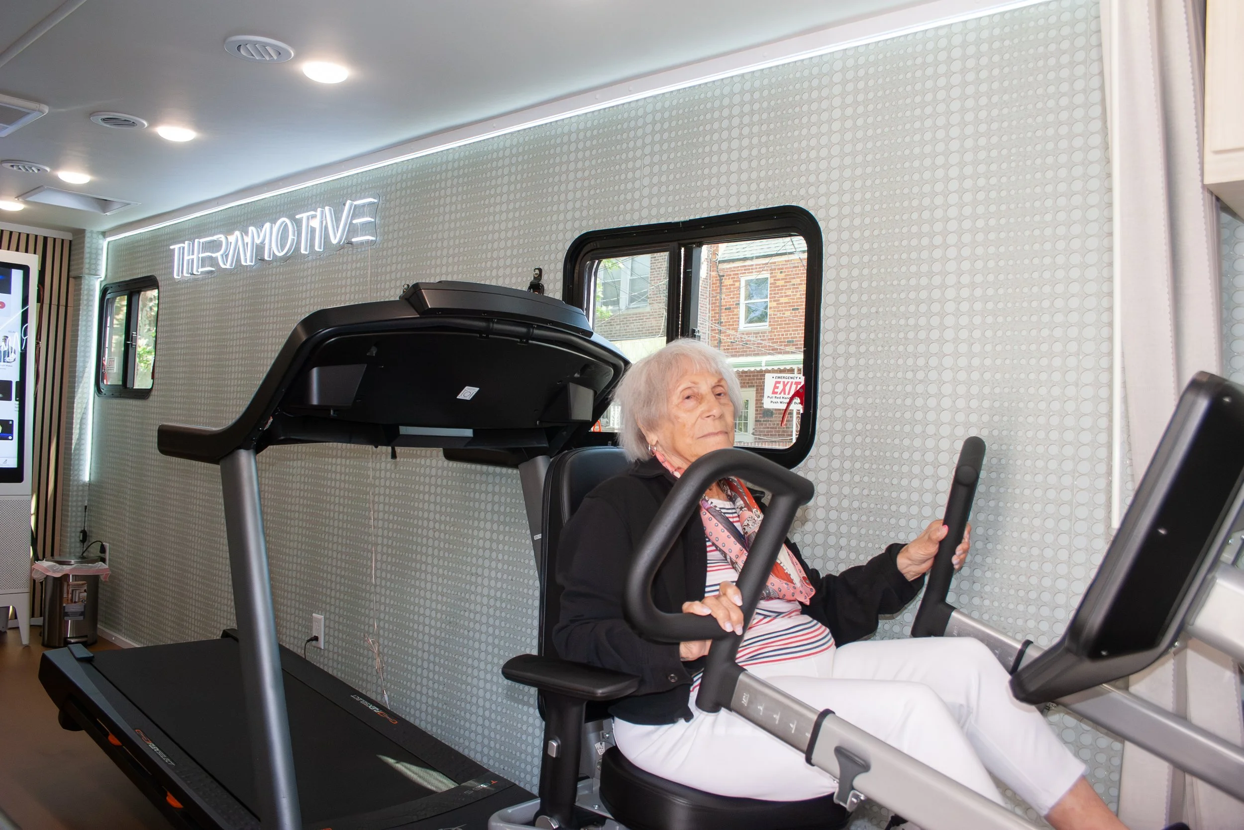 Patient receiving physical therapy inside a mobile clinic