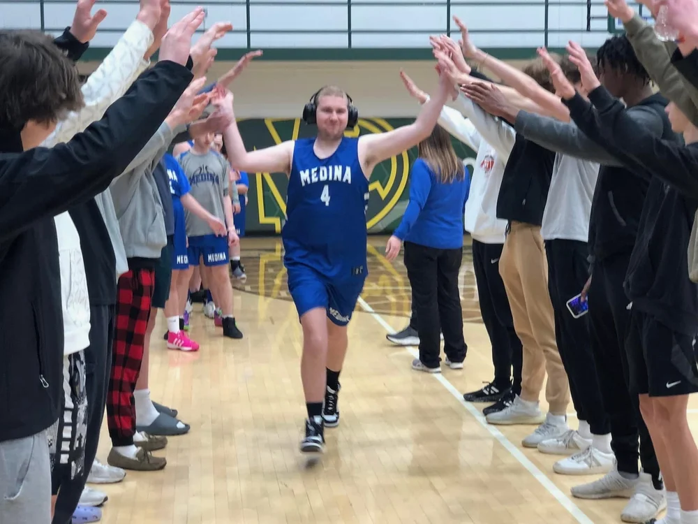 Flash athletes celebrating with high fives.