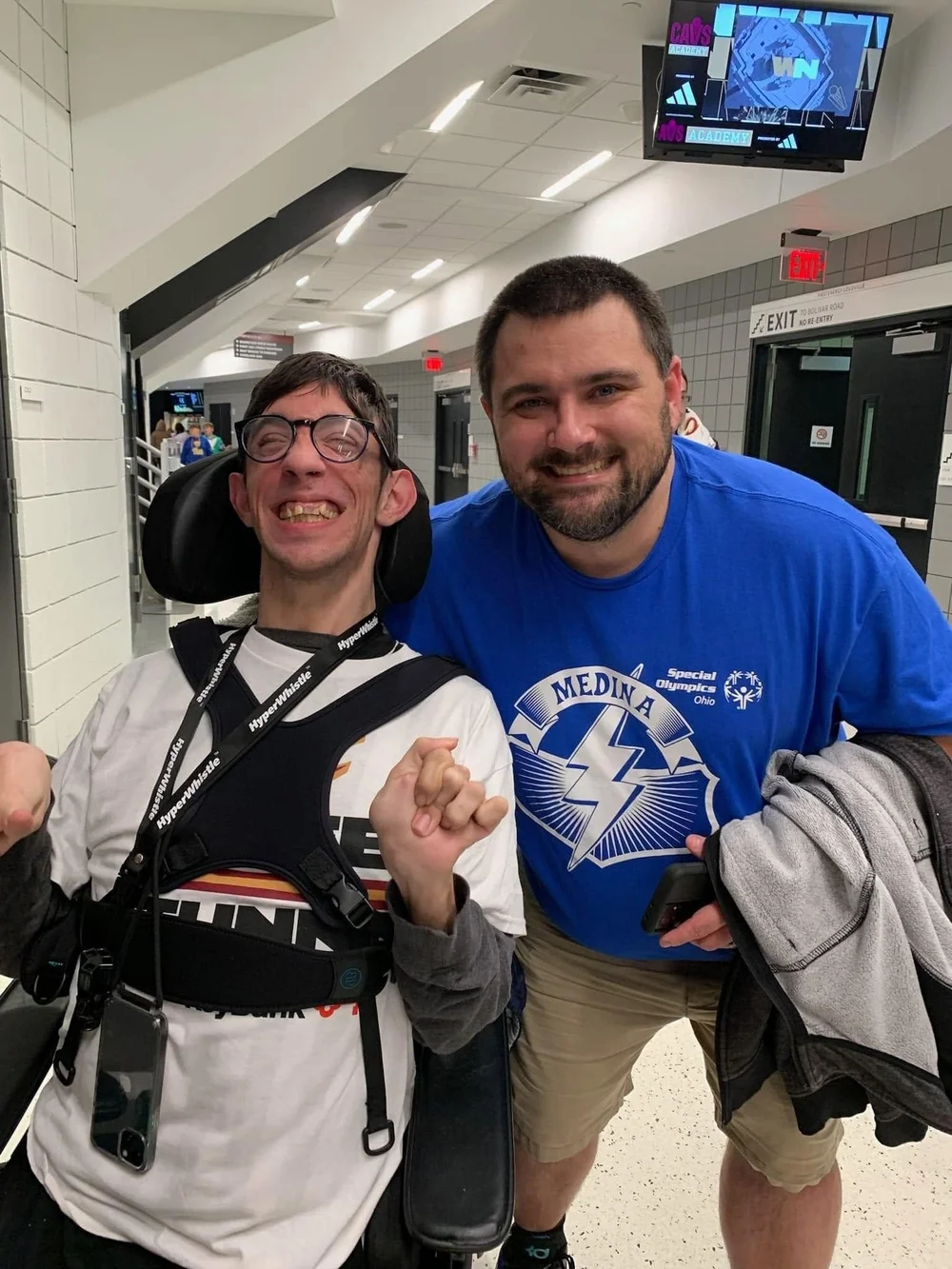 Two Flash teammates celebrating together at the gym.