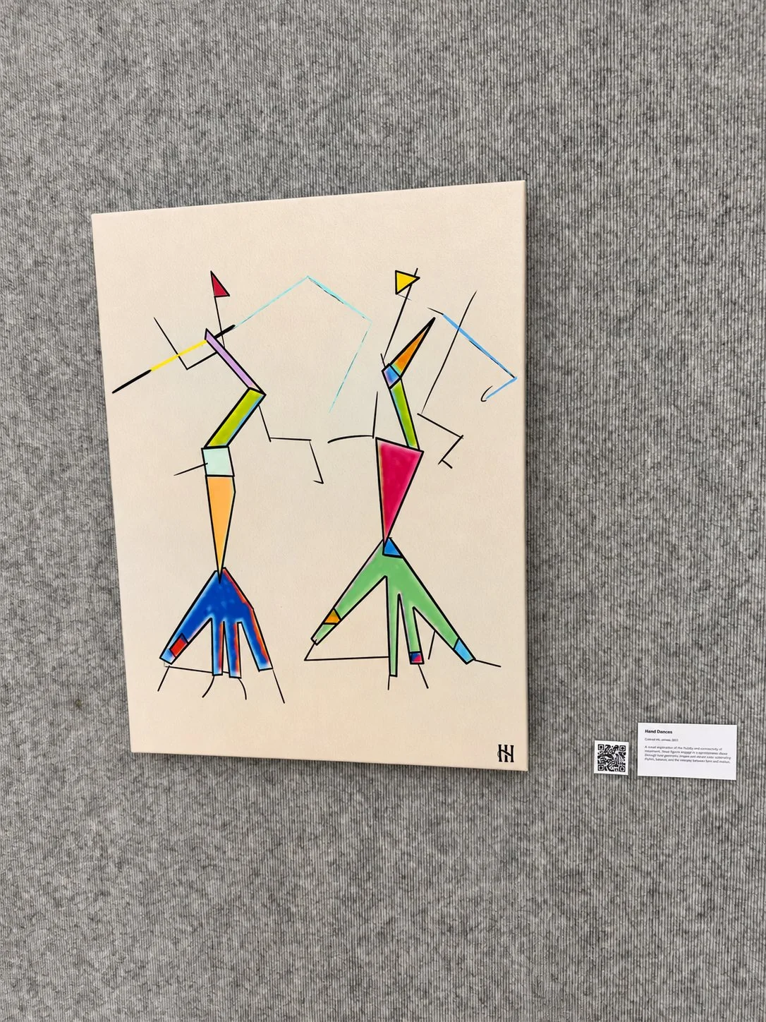 Hand Dances by Hank Hehmsoth installed with QR code and wall label at Brazosport College.