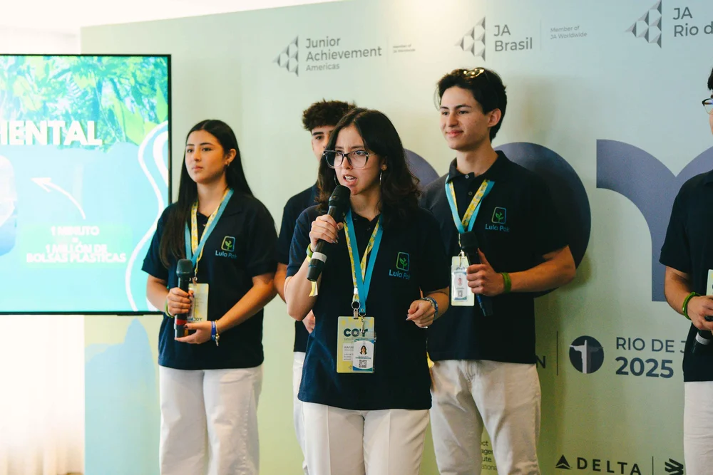 Student team pitching their company on stage