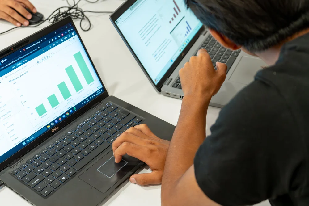 Student taking the Entrepreneurial Skills Pass exam on a laptop