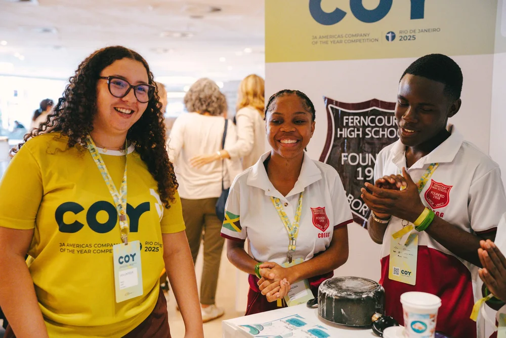 Students and volunteers at a Company of the Year stand
