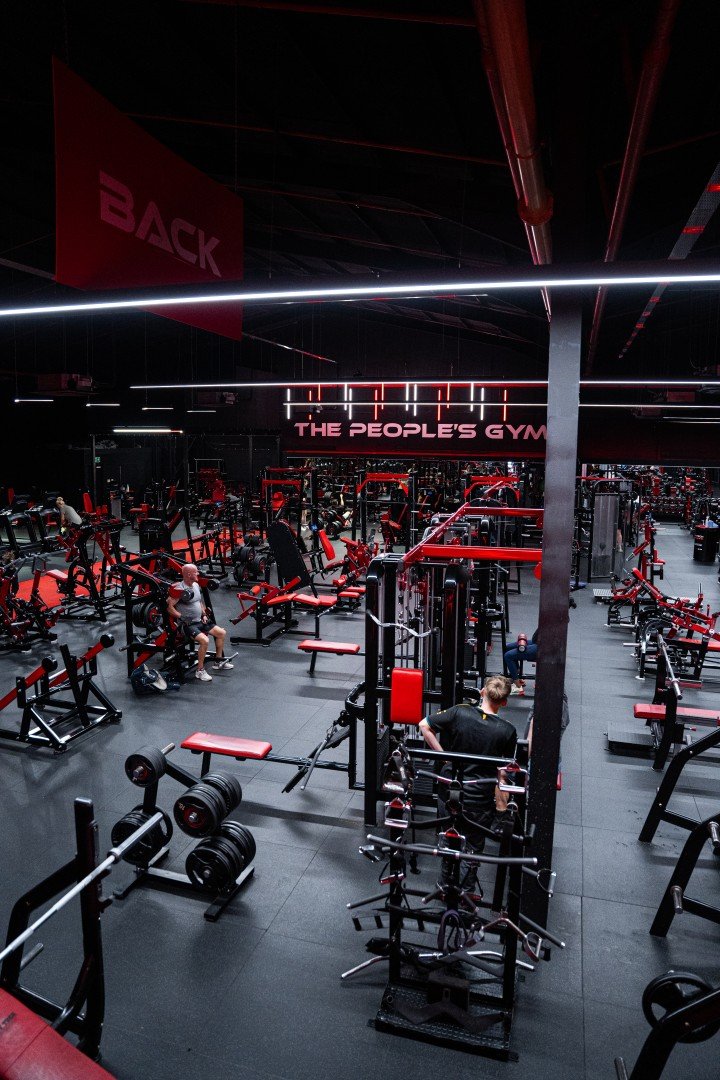 Members training among the red strength equipment at Body Tech Winsford