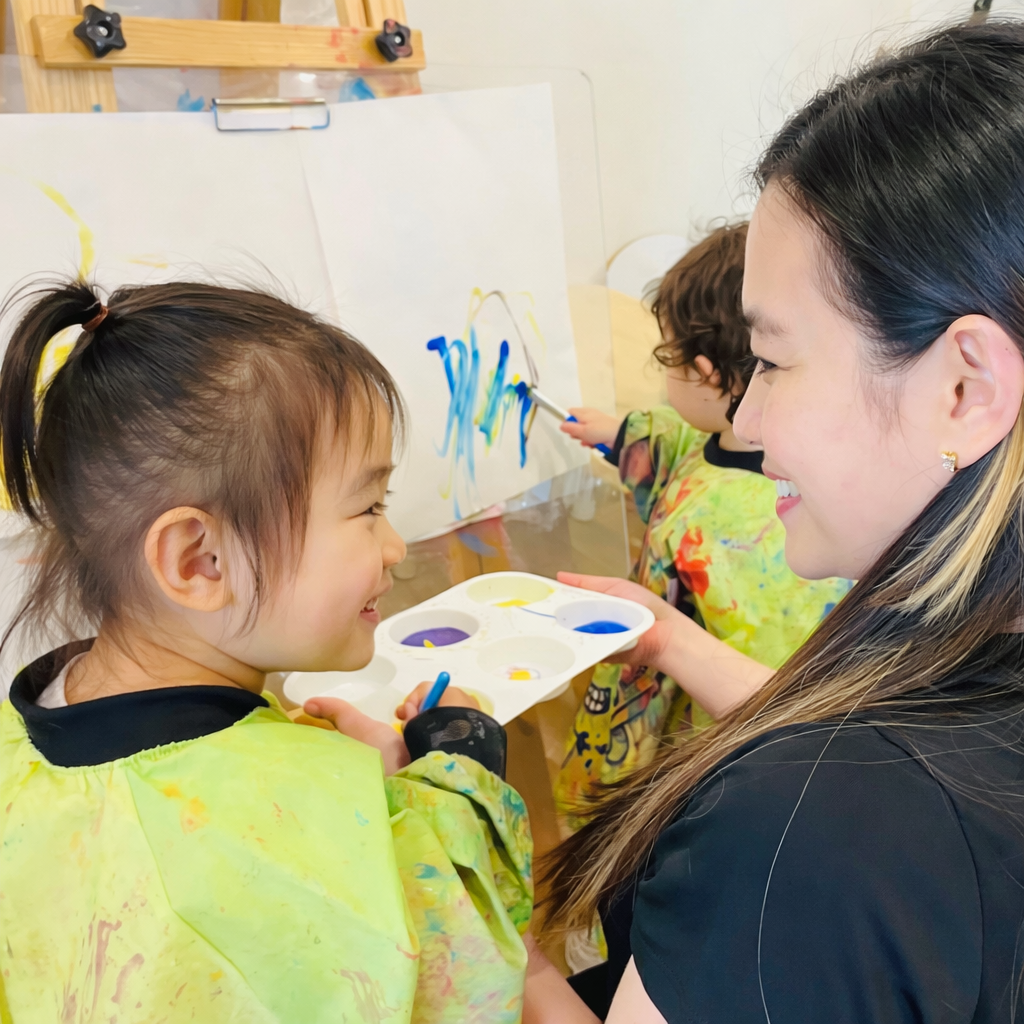 Kelvin Kindergarten educator supporting a child during a calm art experience