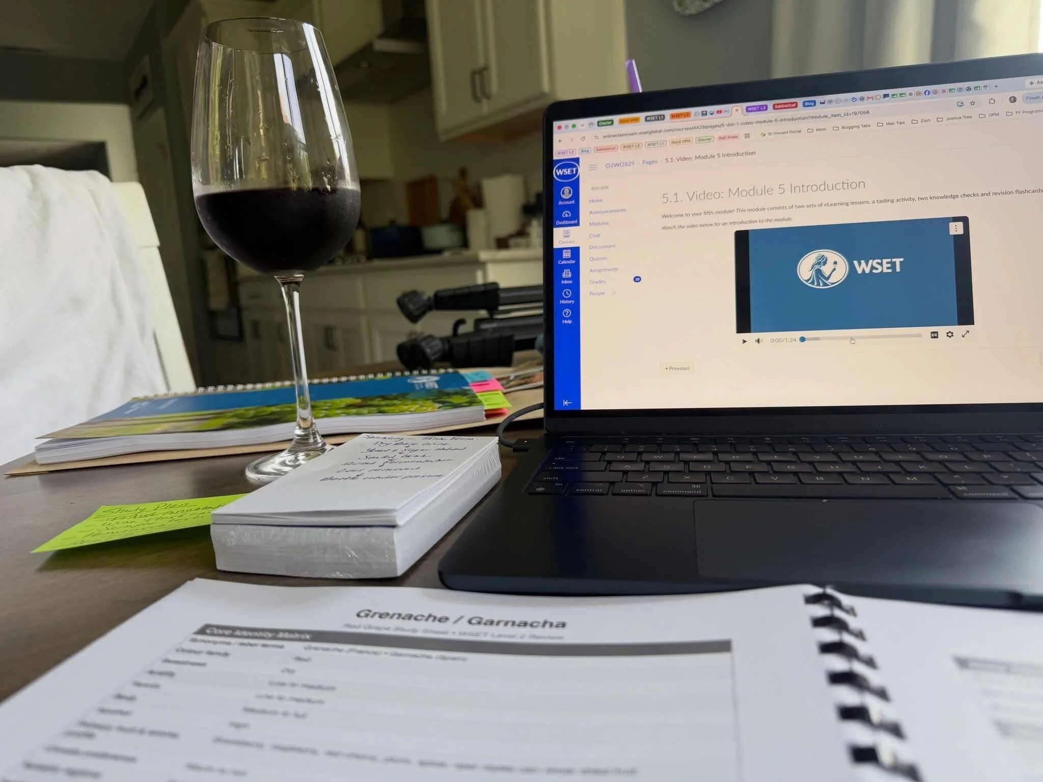Wine tasting glass with WSET certification study materials