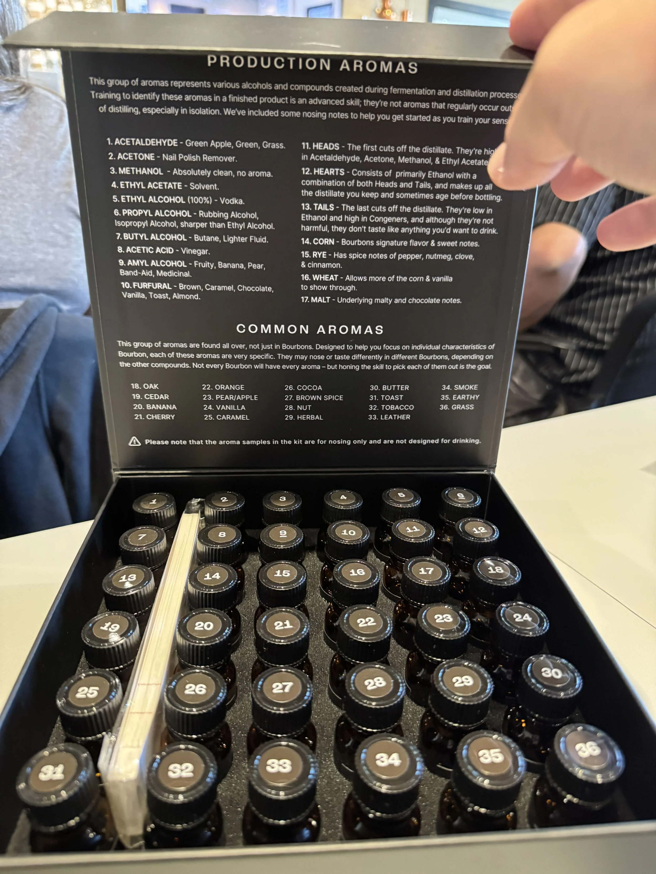 A sensory training kit with many vials that contain whiskey production aromas and common nose and tasting aromas.