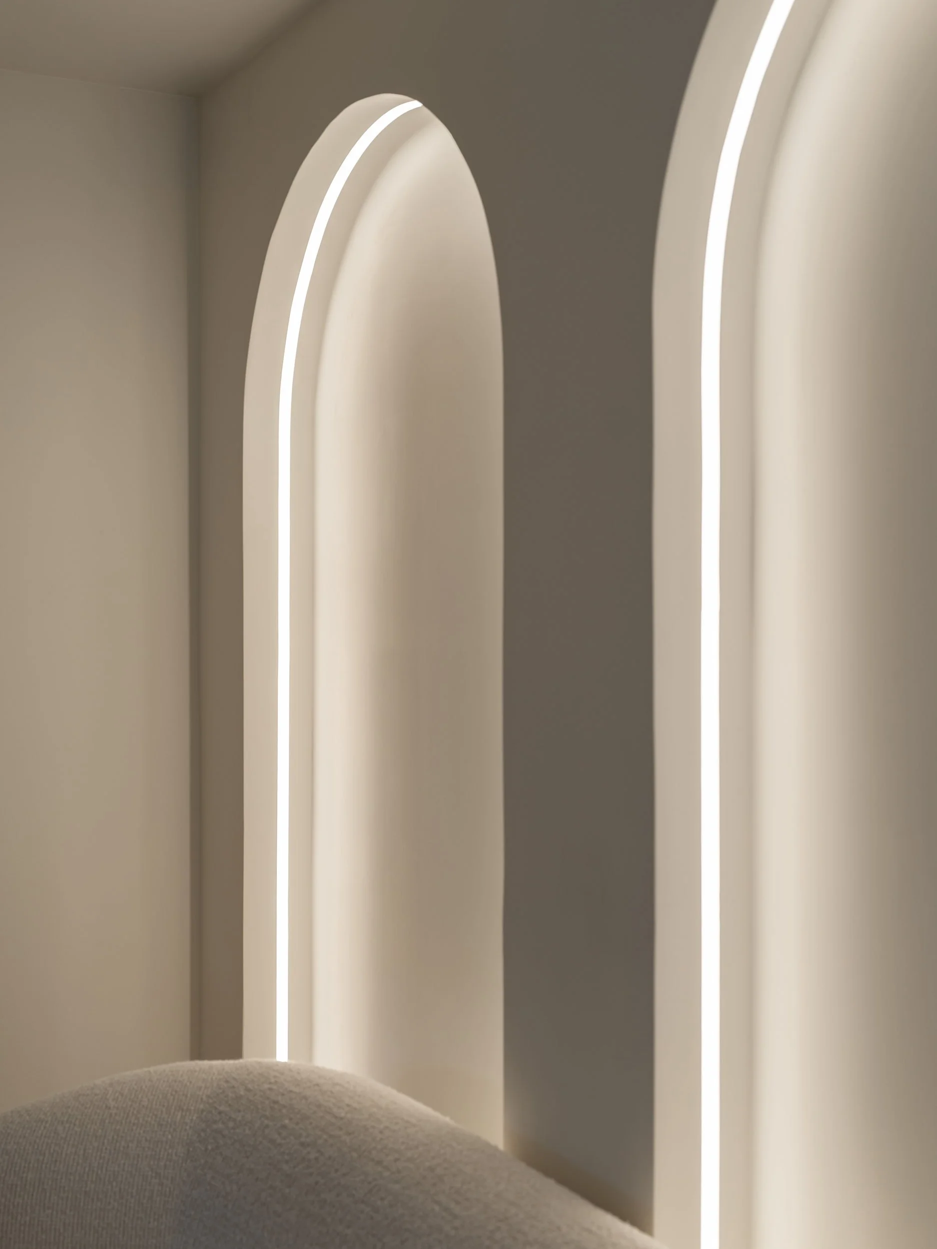 Detail of arched niches with continuous integrated light lines.