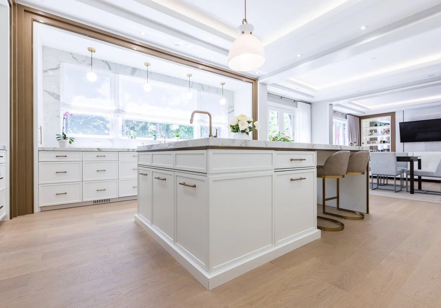 Second island with bar seating, opening to the family room.