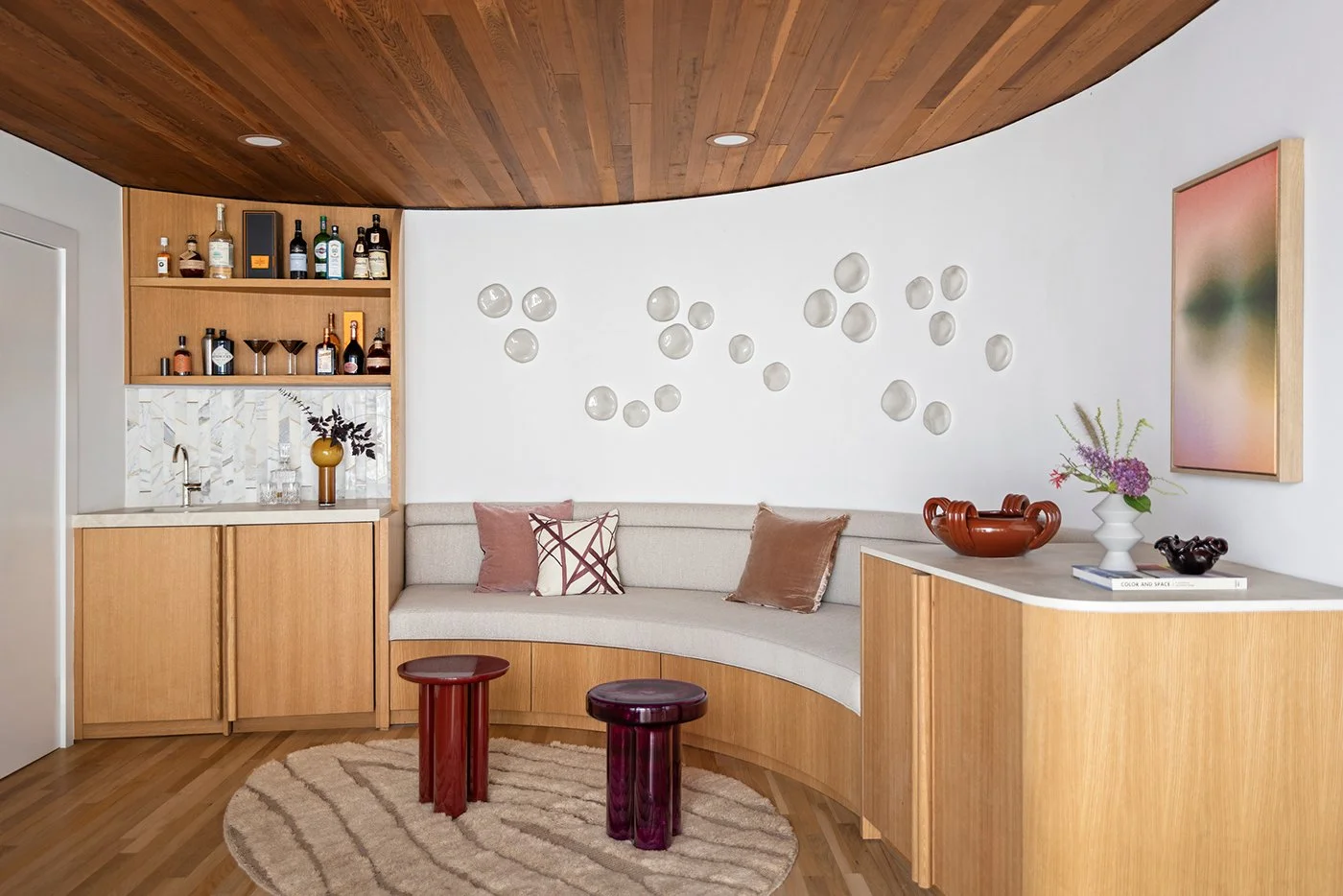 Modern home bar, curved banquette, custom oak cabinetry