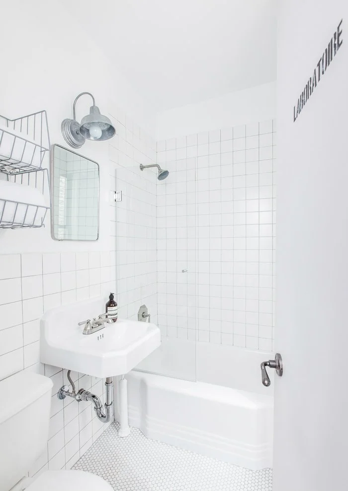 Upper East Side Apartment, white utilitarian bathroom with industrial accents