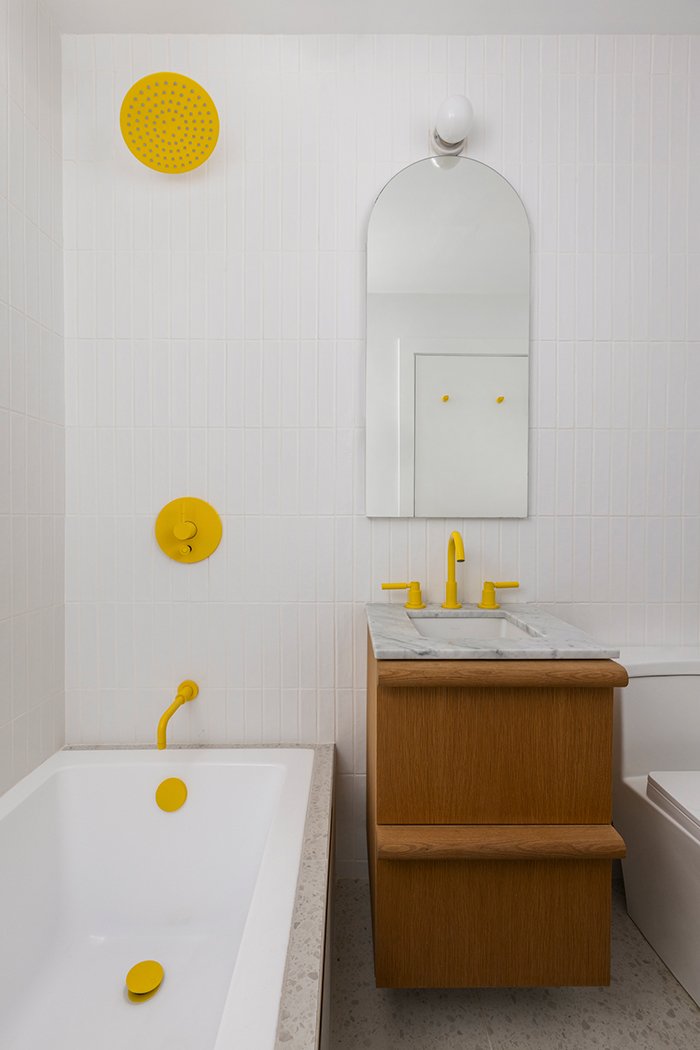 Modern bathroom, yellow fixtures, white tile, oak vanity