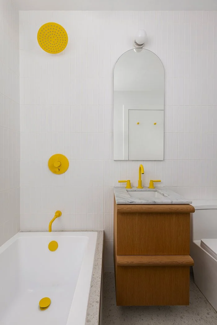 Modern bathroom, yellow fixtures, white tile, oak vanity