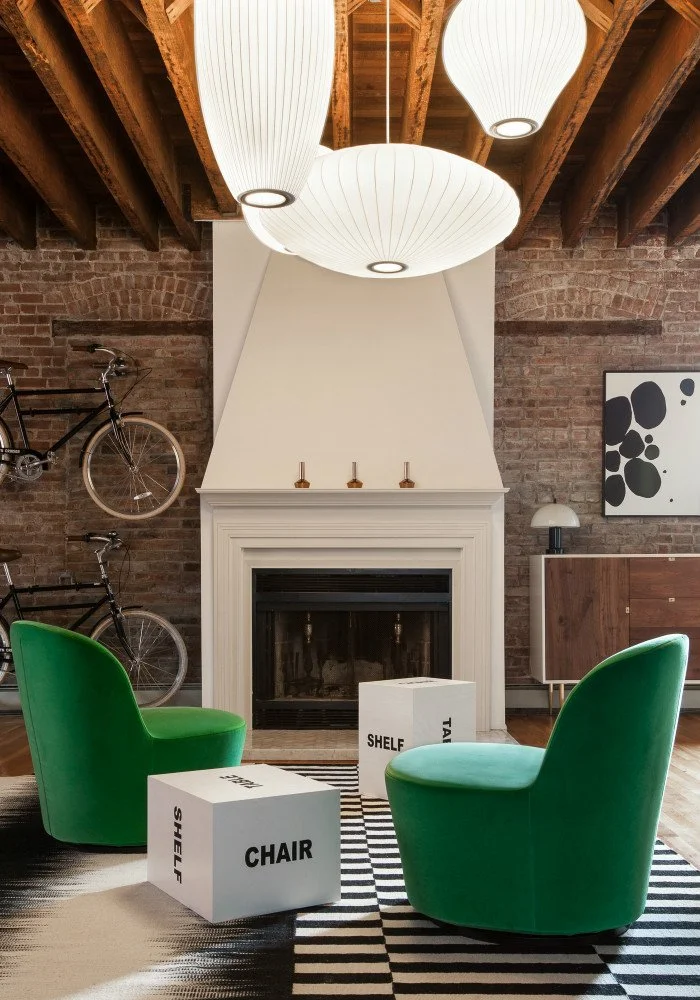 Jersey City Loft, green chairs with graphic stools and rugs