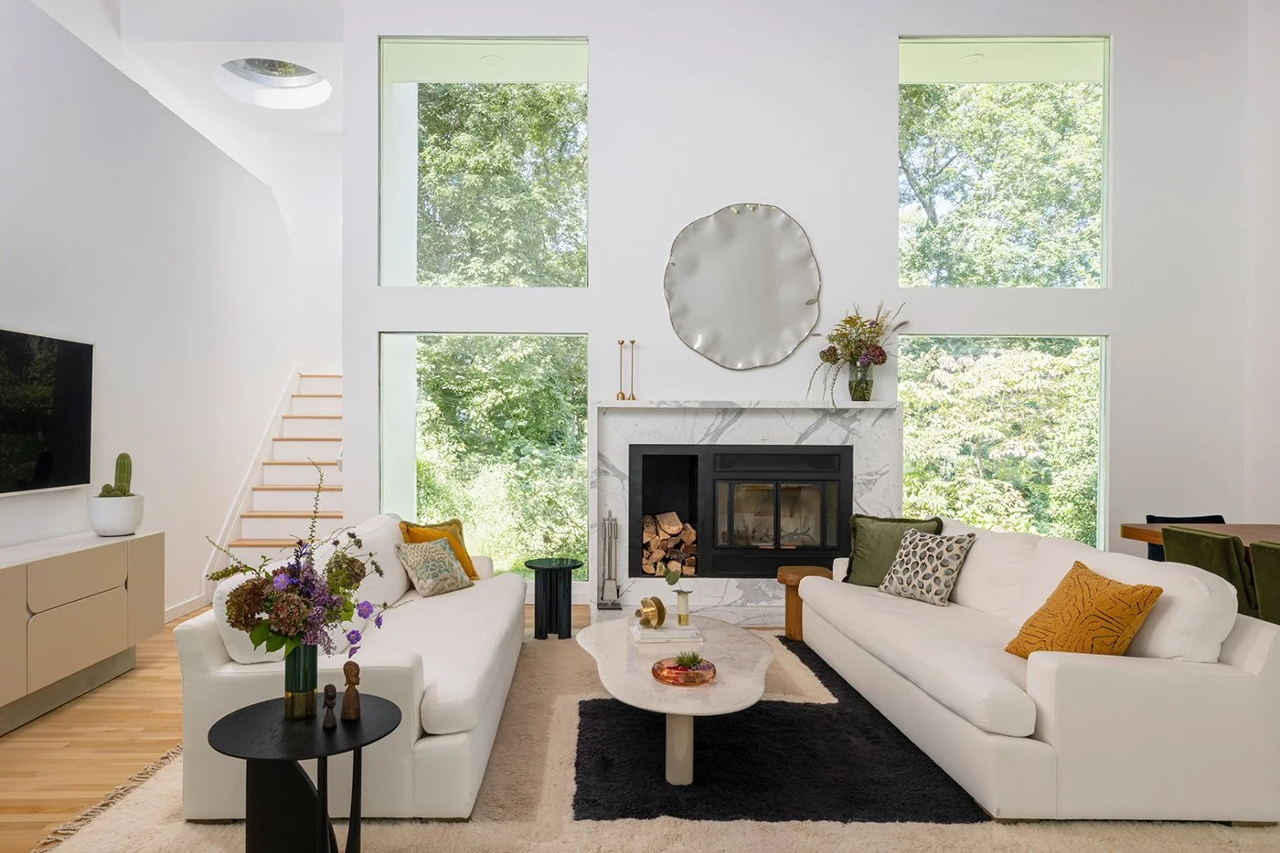 Modern living room, double height floor to ceiling windows