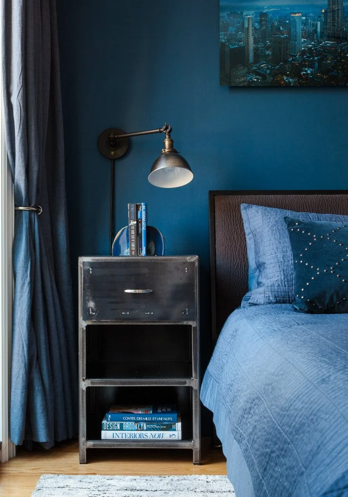 Chelsea Duplex, blue drapes with pewter sconces