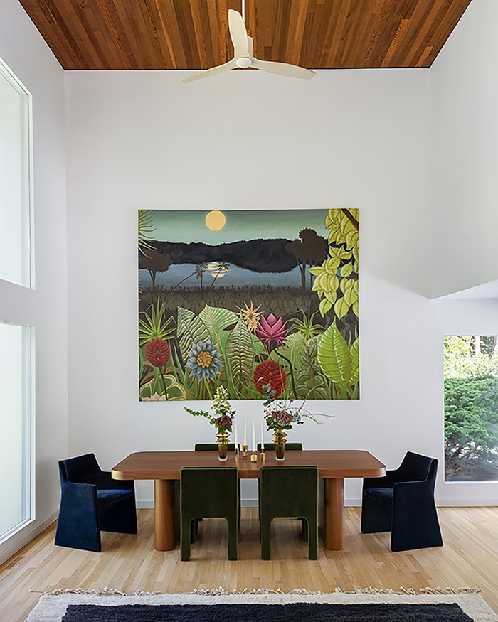 Modern dining room, double height ceiling, statement artwork
