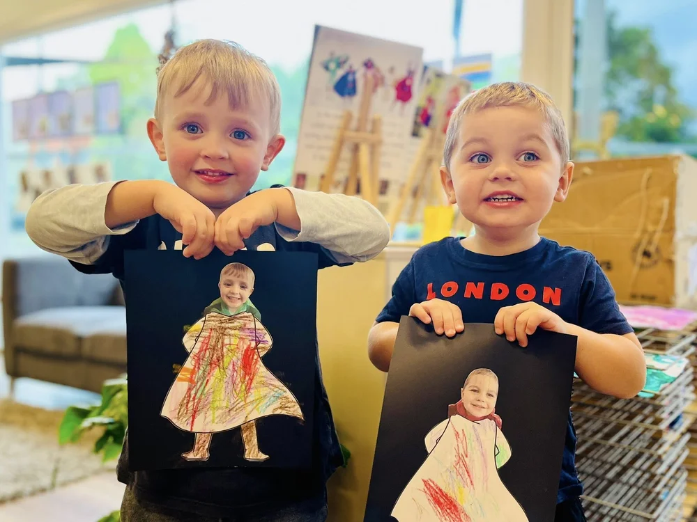 Children proudly sharing their artwork
