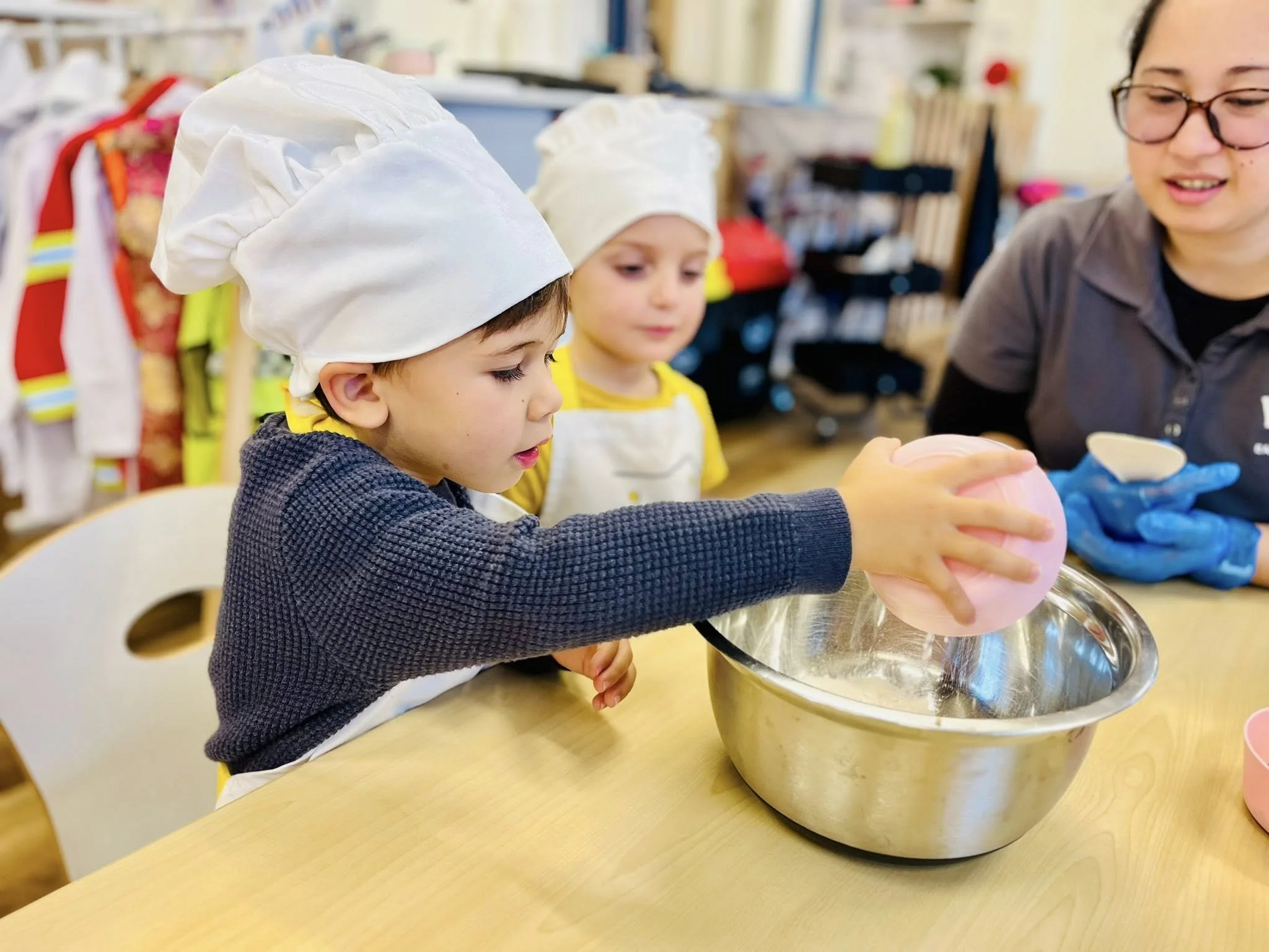 Children cooking with an educator at Balgowlah Early Learning