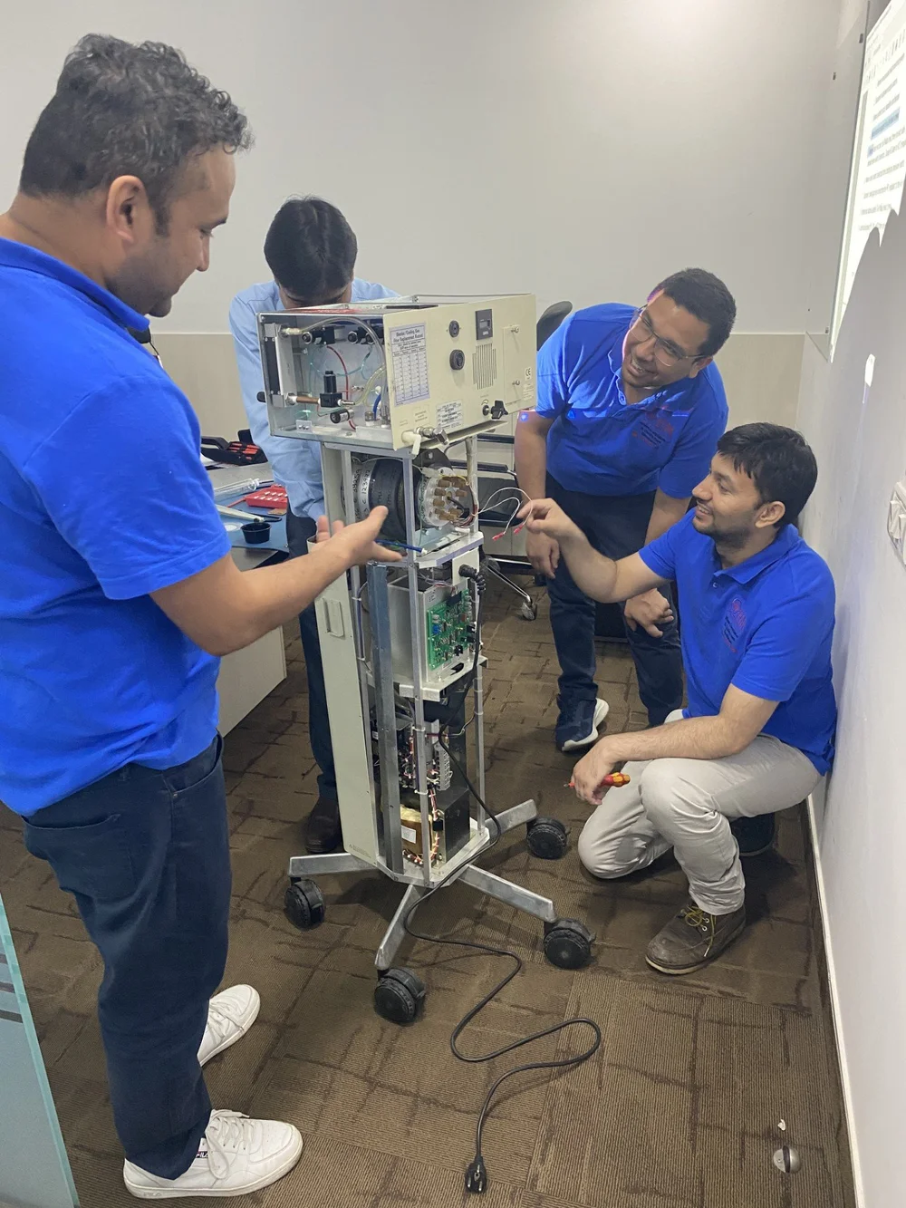 OHM biomedical engineer servicing medical equipment