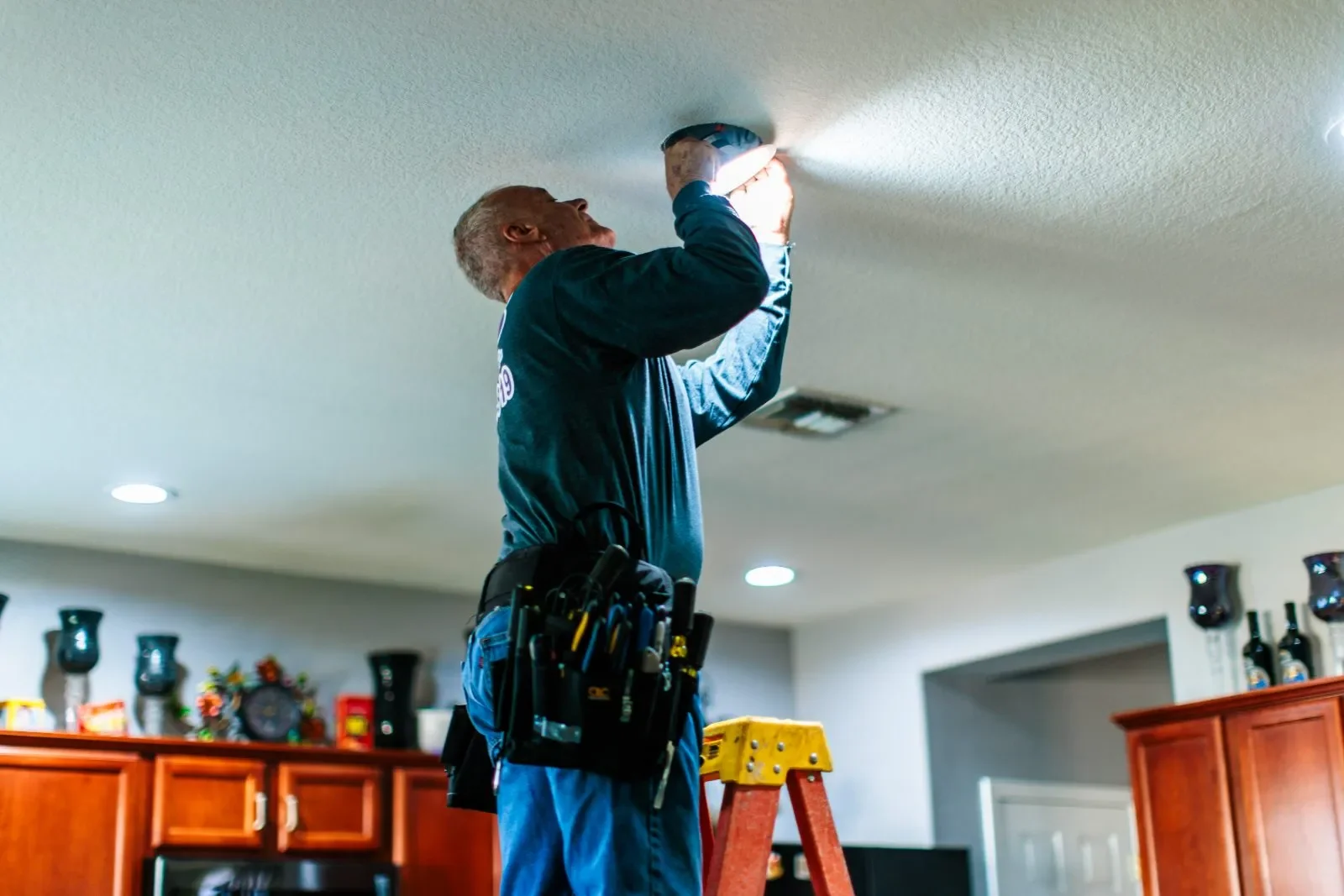 Electrician replacing ceiling fixture — RSB Electrical, Mesa AZ