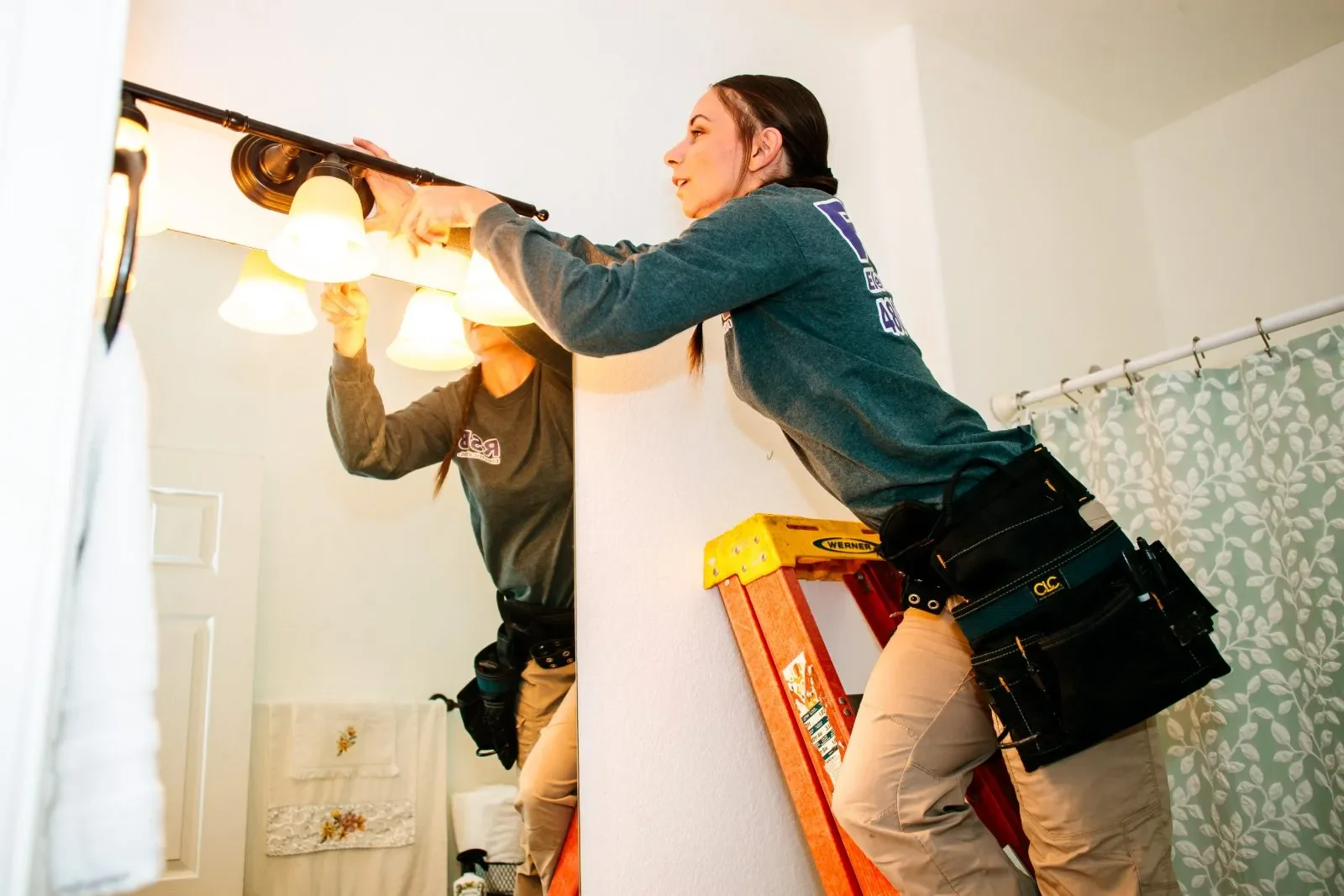 Electrician installing light fixture — RSB Electrical, Mesa AZ