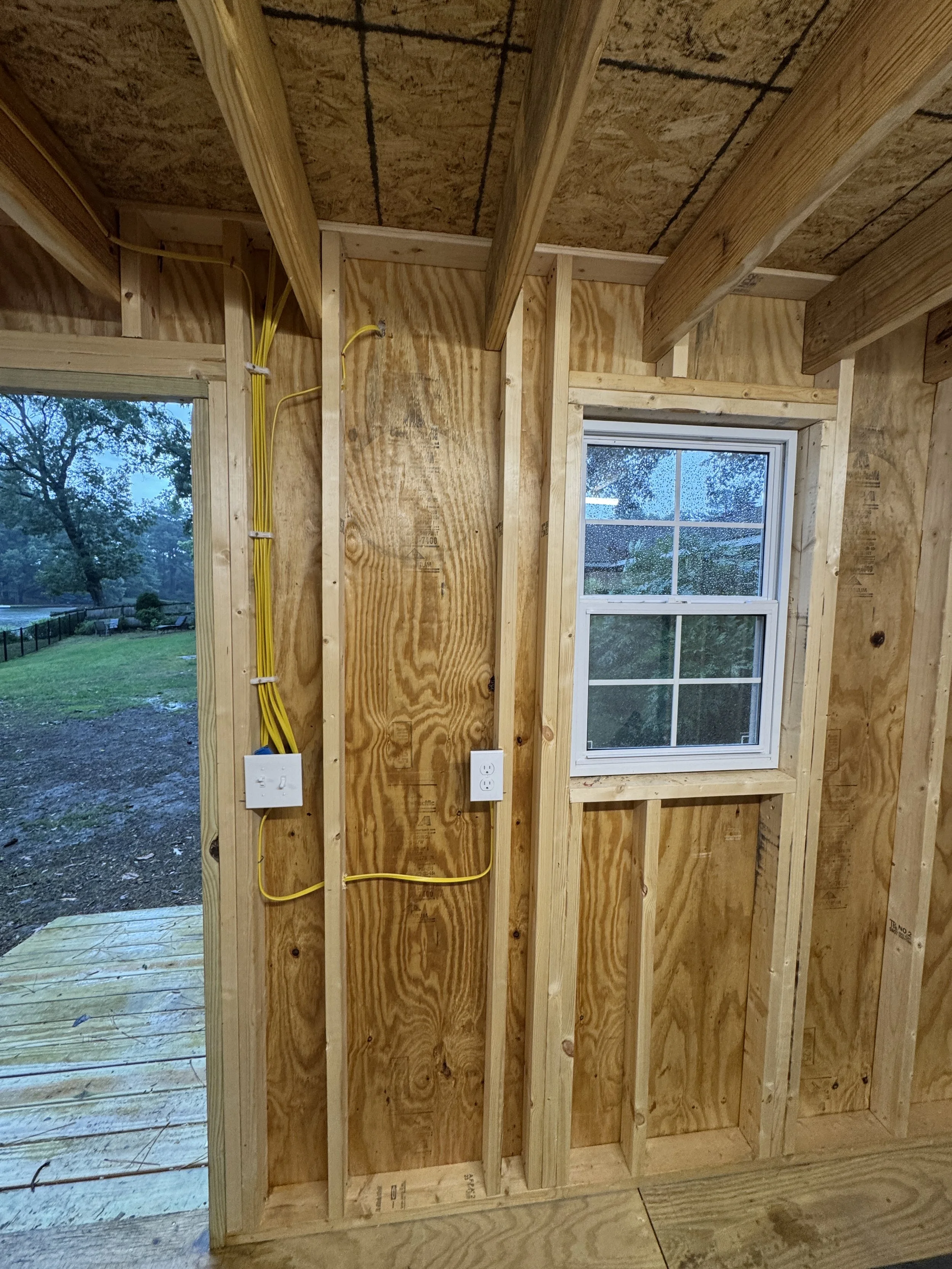 Cable and a device box roughed into an open stud wall in Chesapeake, VA
