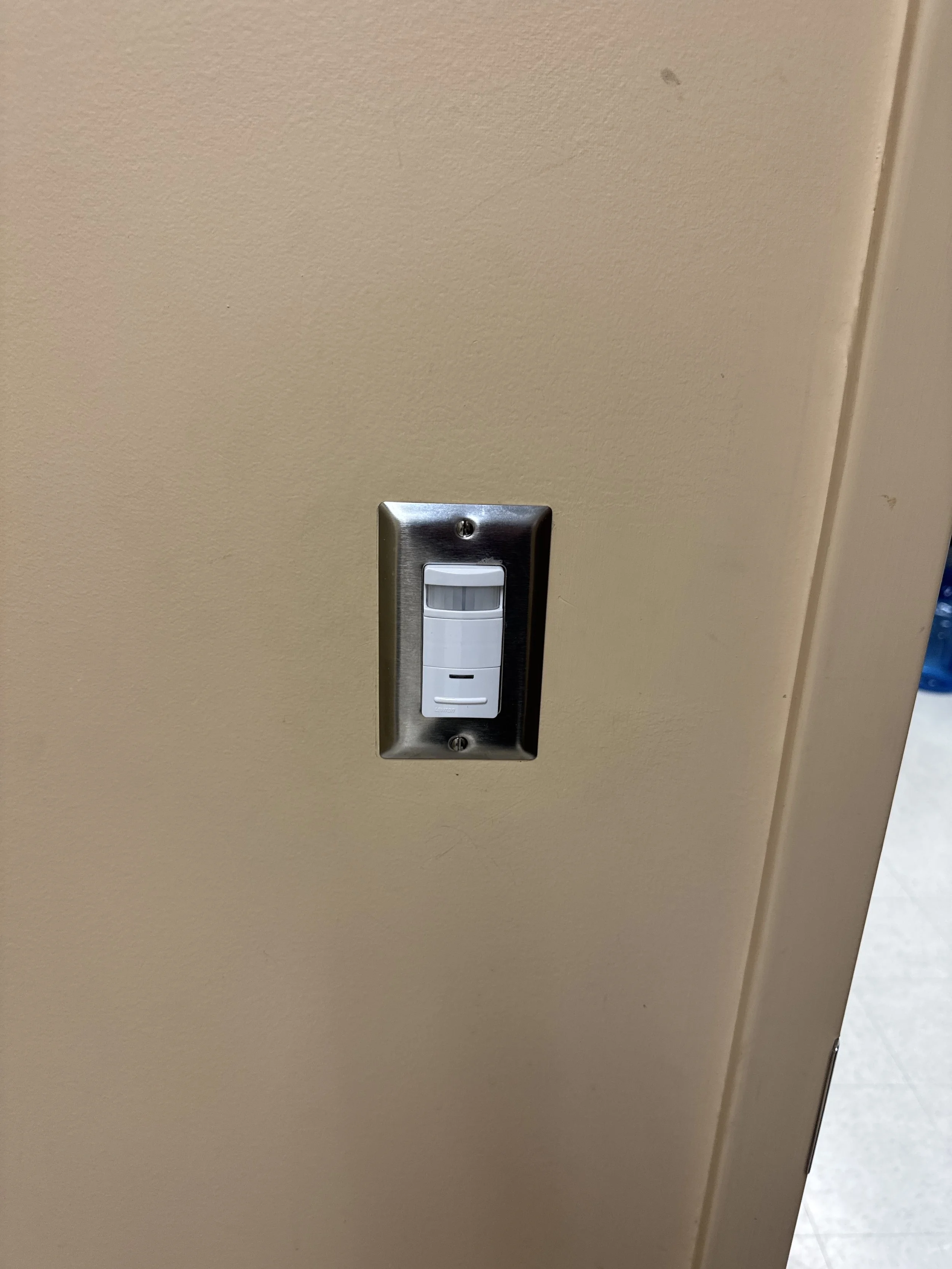 Occupancy sensor switch fitted in a switch box in a Portsmouth, VA home