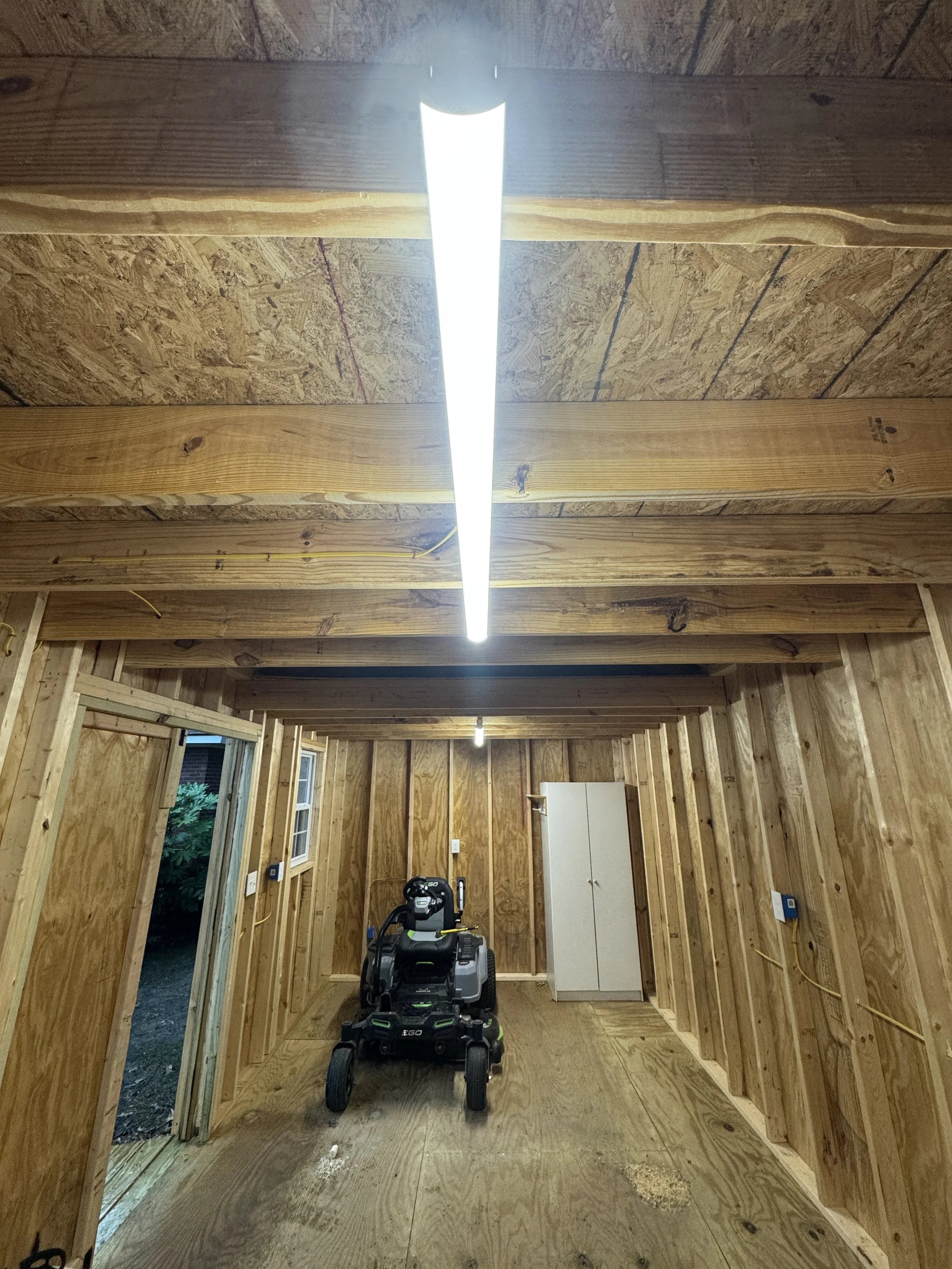 Detached wood workshop in Suffolk, VA with its lighting and power run